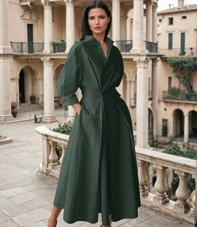 Elegant midi dress with a wide line, high neck and three-quarter sleeves