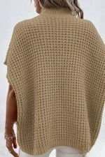 Elegant beige sweater with puff sleeves and a high neck