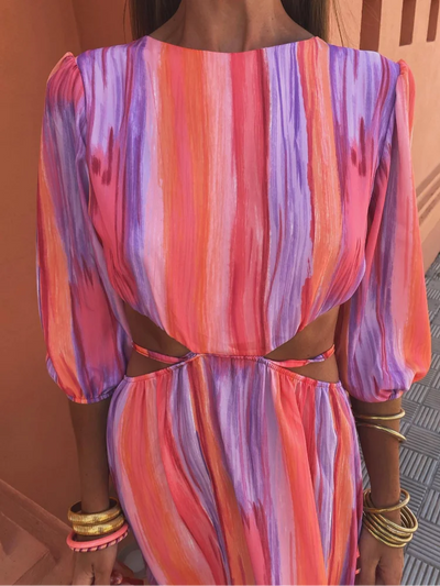 Elegant long dress with short puff sleeves and open back design