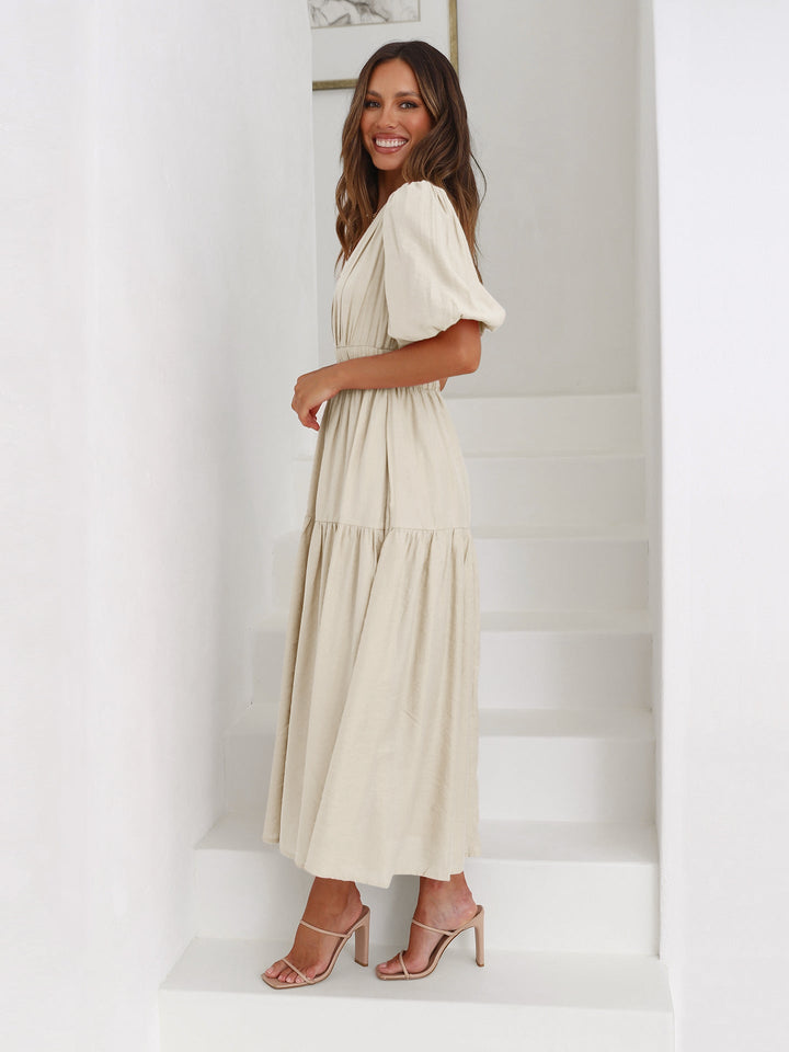 Sophisticated women's dress with contemporary puff sleeves