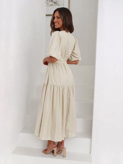 Sophisticated women's dress with contemporary puff sleeves