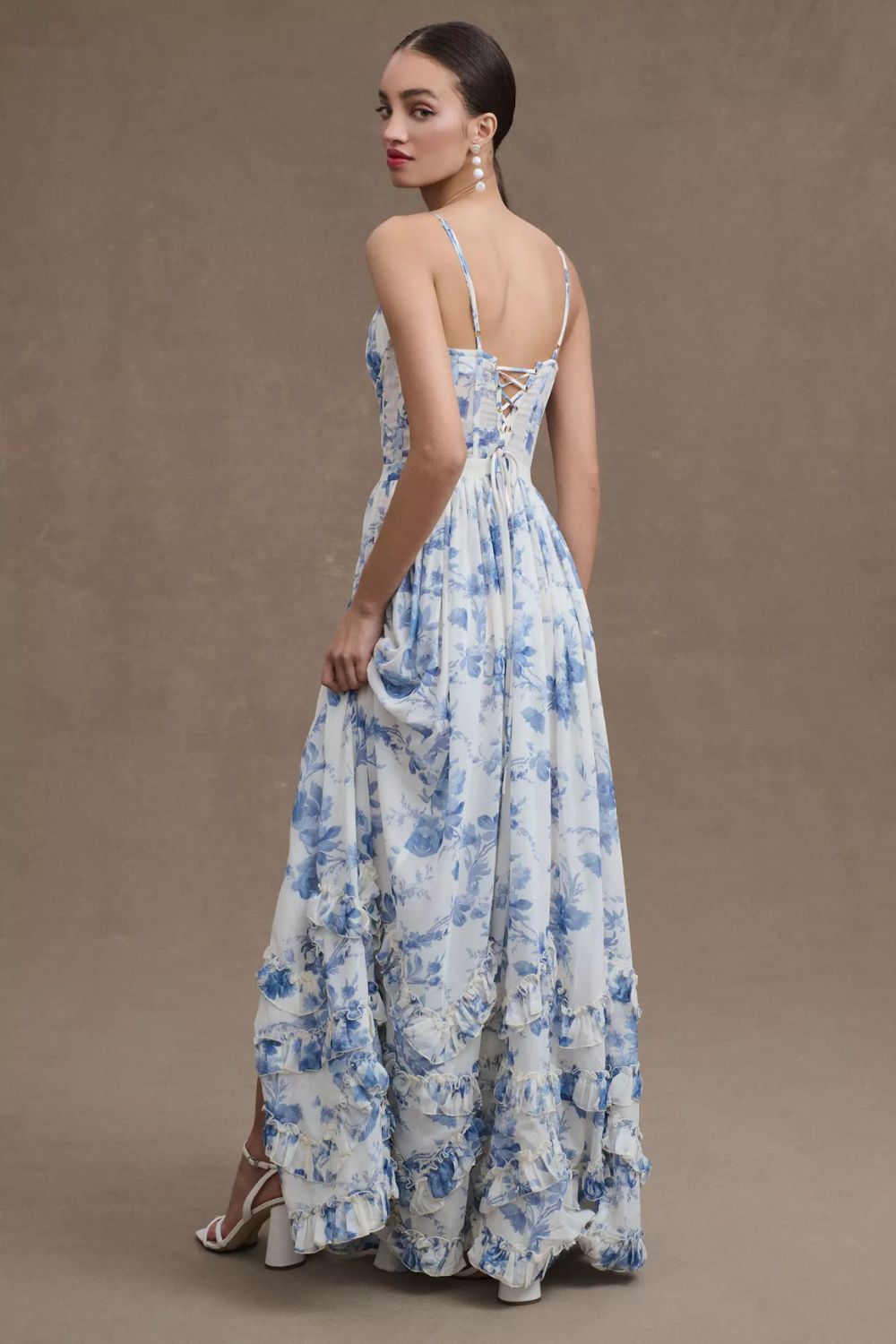 Long corset dress with thin straps and ruffled hem in a floral design