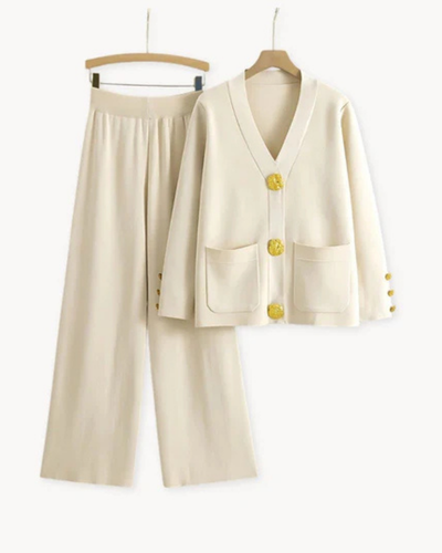 Elegant feminine ensemble with a large-buttoned jacket and wide-legged trousers
