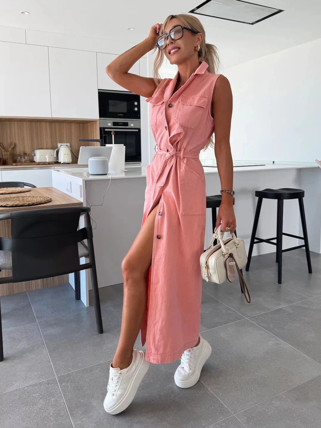 Modern sleeveless maxi dress with full button-down design