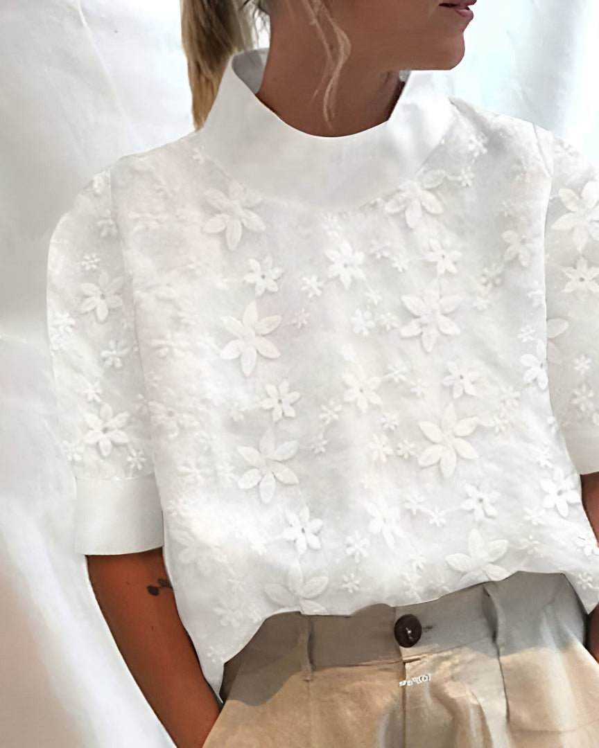 Elegant blouse with a wide high neck and modern design