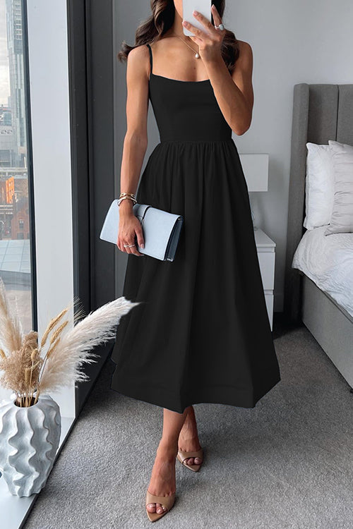 Midi dress with thin straps and flared cut and defined waist