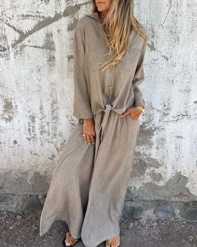 Elegant women's summer set with wide-legged trousers and a long-sleeved button-down blouse