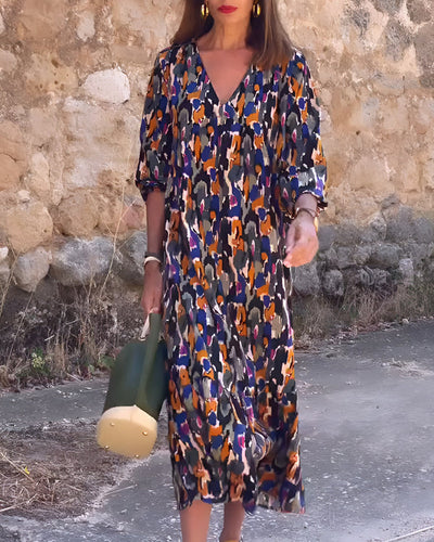 Midi dress with a V-neck and elegant retro print