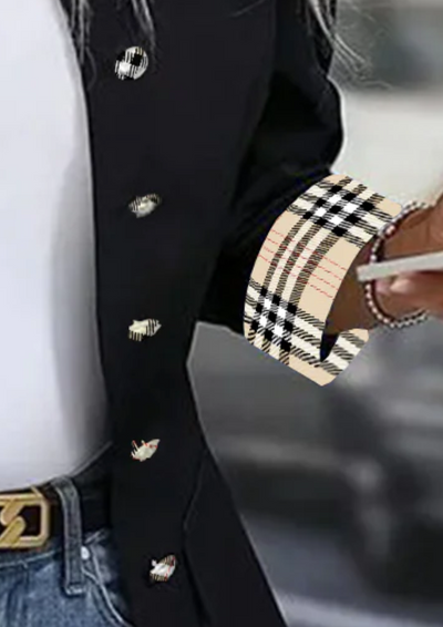 Modern women's blazer with a high collar and checked cuffs