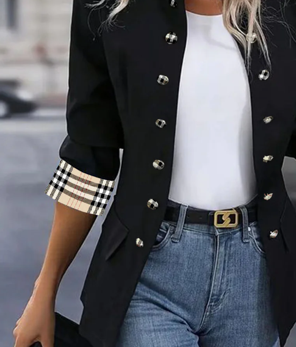 Modern women's blazer with a high collar and checked cuffs