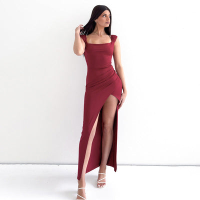 Long sleeveless dress with square neckline and elegant side slit