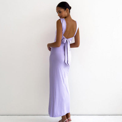 Long sleeveless dress with square neckline and elegant side slit