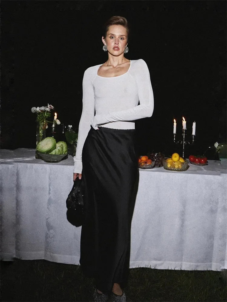 Maxi skirt with a shiny finish and side slit