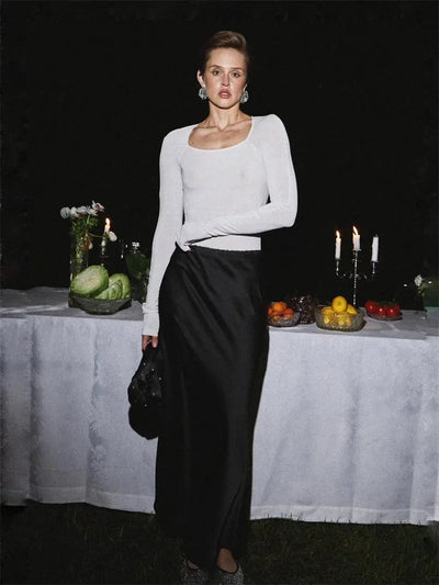 Maxi skirt with a shiny finish and side slit