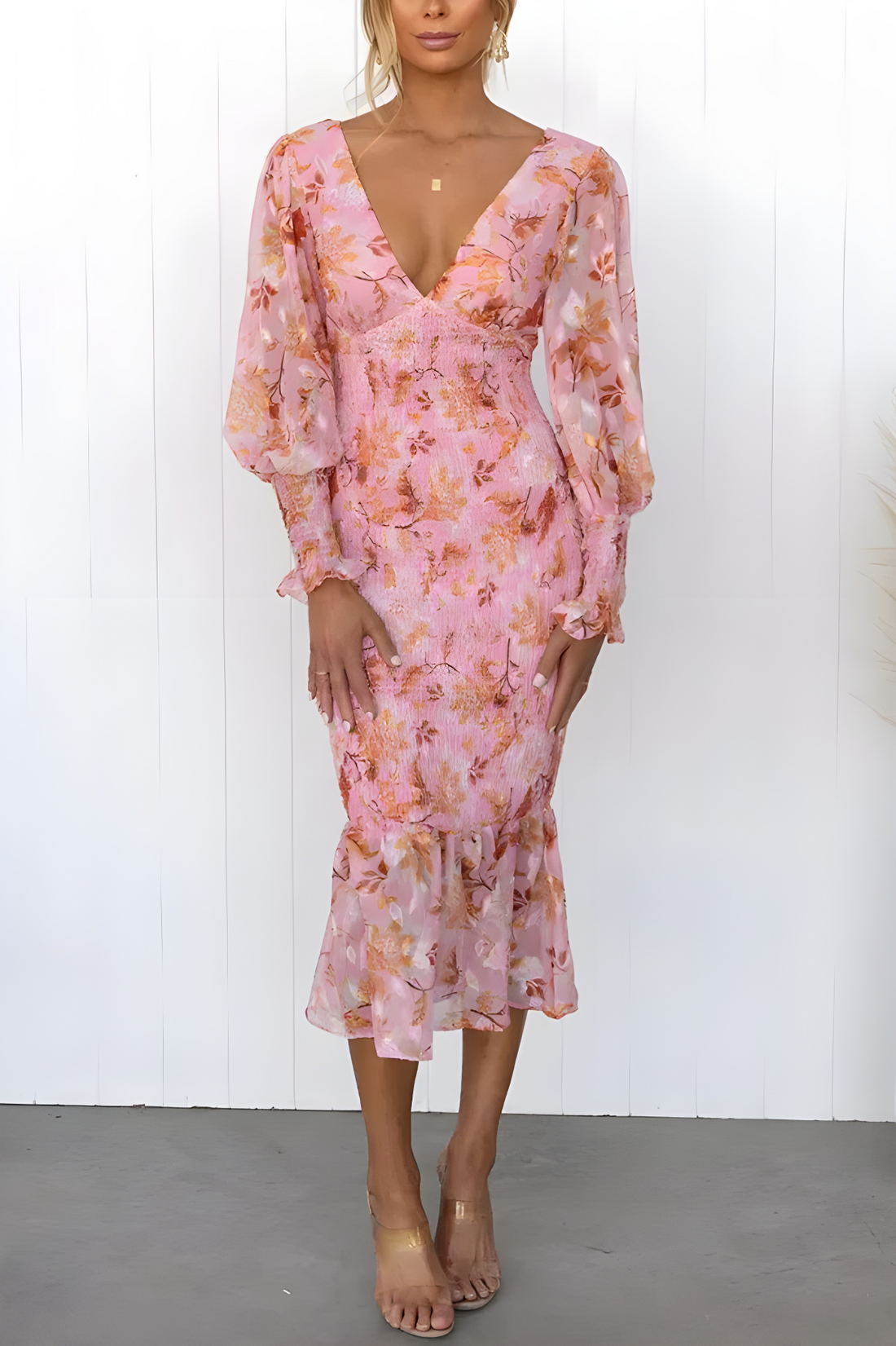 Flowy midi dress with long sleeves and a subtle floral print for an elegant look