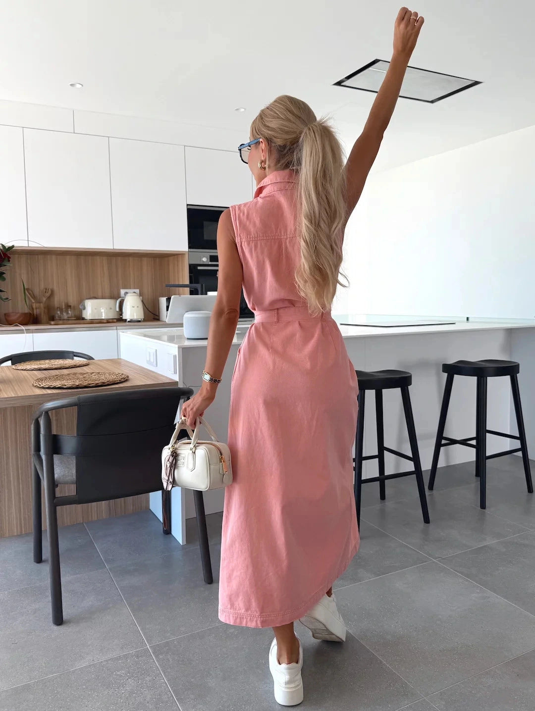 Modern sleeveless maxi dress with full button-down design