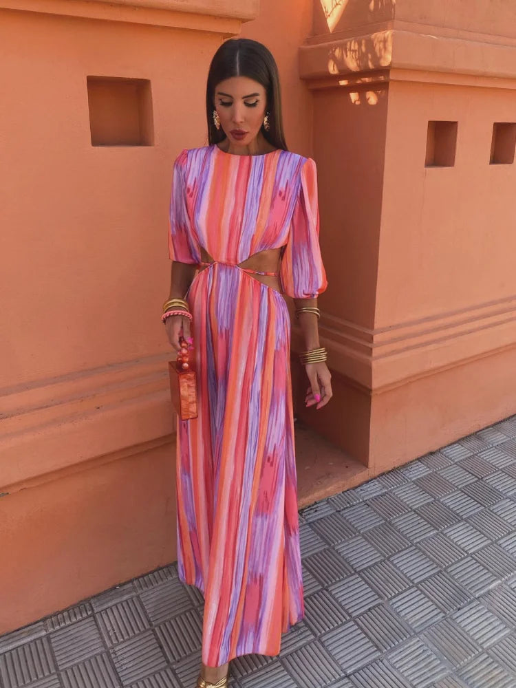 Elegant long dress with short puff sleeves and open back design