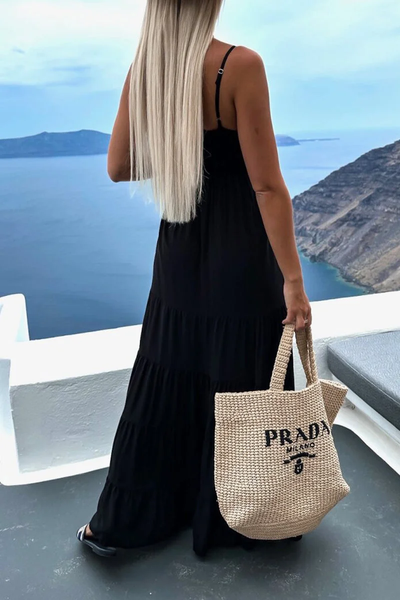 Elegant long dress with a V-neckline and pleated layered skirt, ideal for any occasion