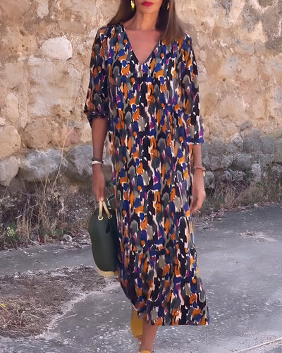 Midi dress with a V-neck and elegant retro print