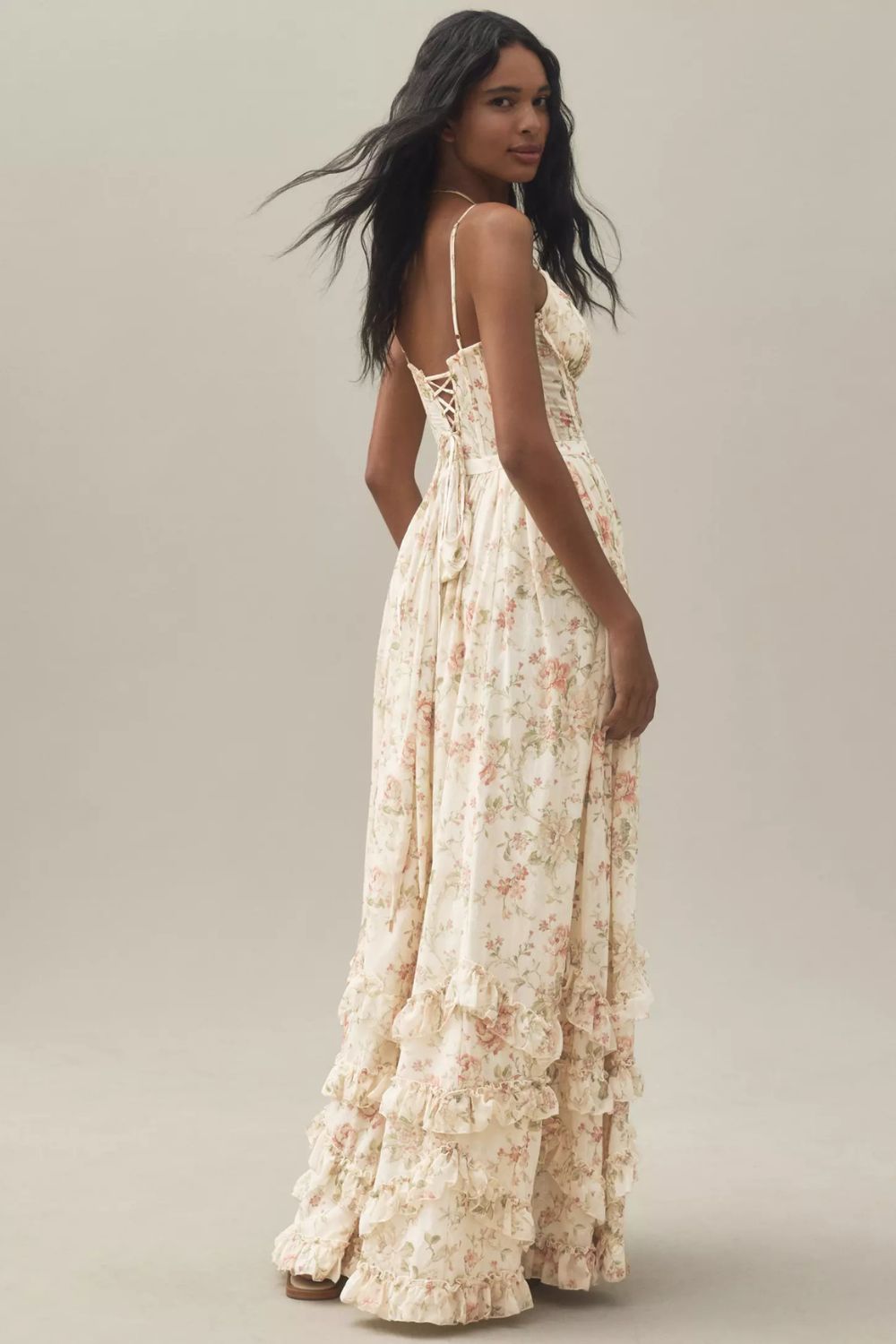 Long corset dress with thin straps and ruffled hem in a floral design