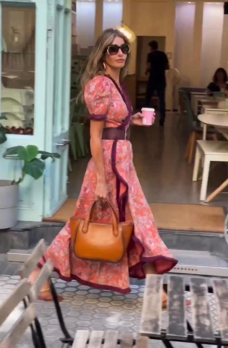 Elegant long dress with short puffed sleeves and asymmetrical skirt