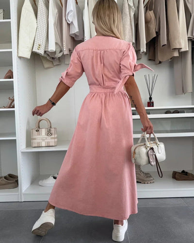 Elegant long dress with a deep neckline and three-quarter sleeves buttoned at the front