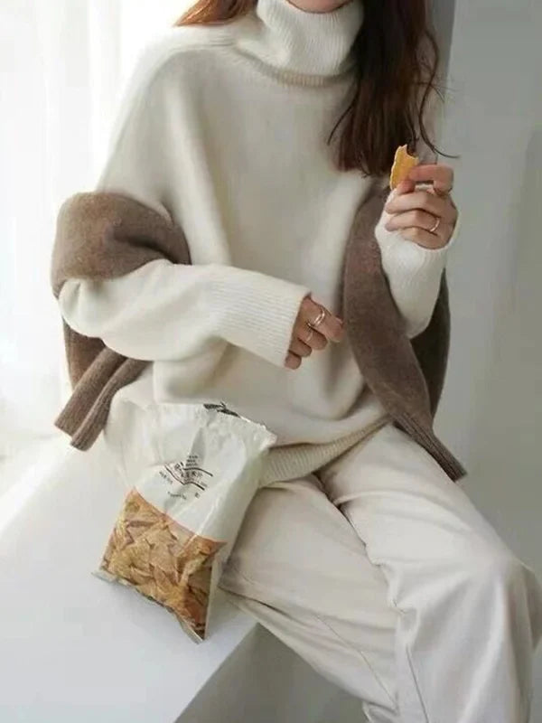 Elegant oversized sweater with long sleeves and a high neck