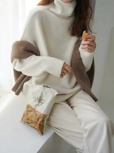 Elegant oversized sweater with long sleeves and a high neck