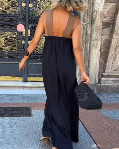 Long sleeveless dress with elegant neckline and modern cut