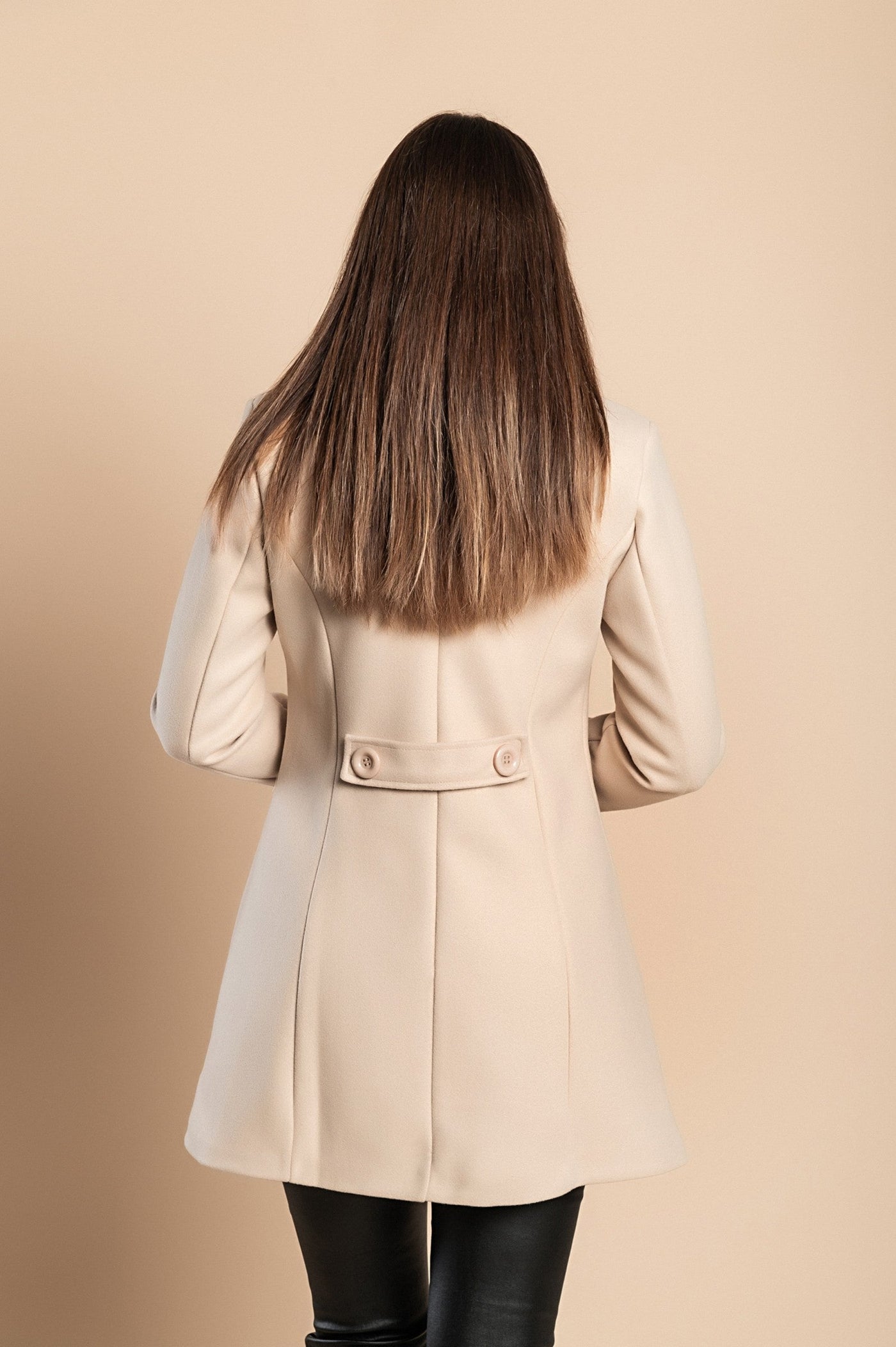 Sophisticated women's coat with elegant button details