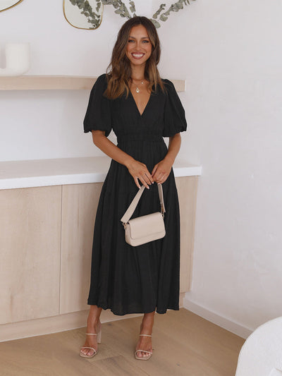 Sophisticated women's dress with contemporary puff sleeves