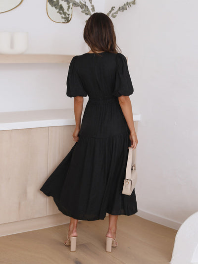 Sophisticated women's dress with contemporary puff sleeves