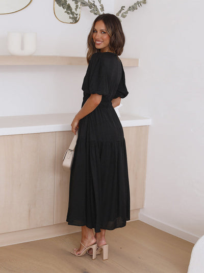 Sophisticated women's dress with contemporary puff sleeves