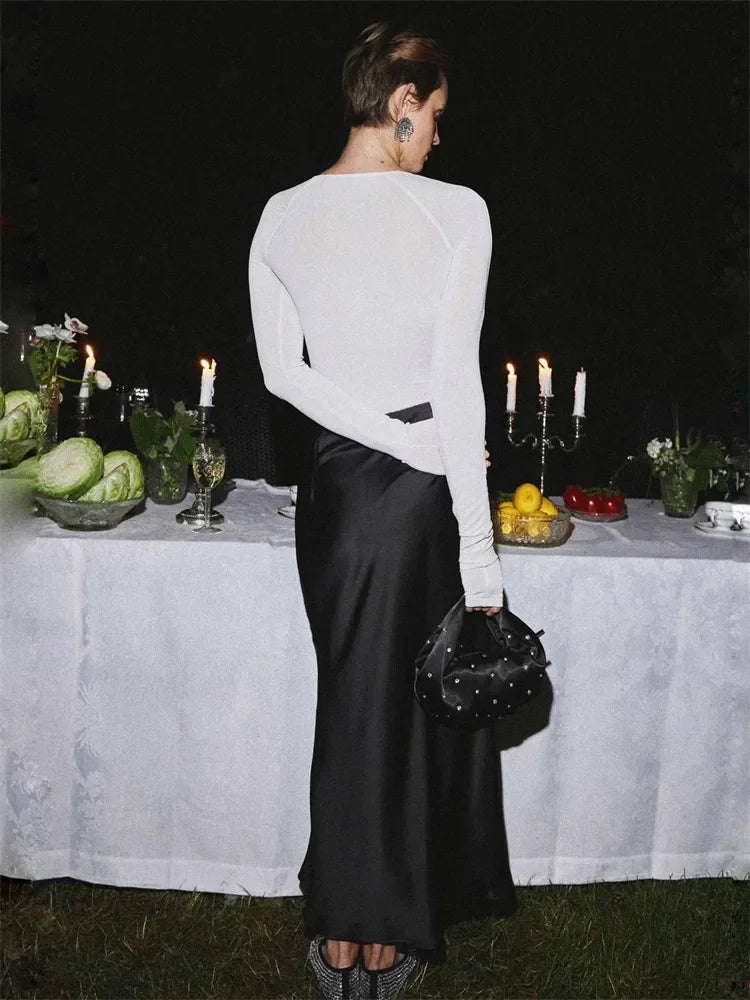 Maxi skirt with a shiny finish and side slit