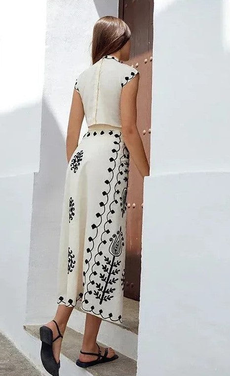 Printed sleeveless top and flowing skirt set, ideal for casual events