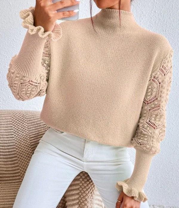 Elegant apricot sweater with sophisticated printed sleeves