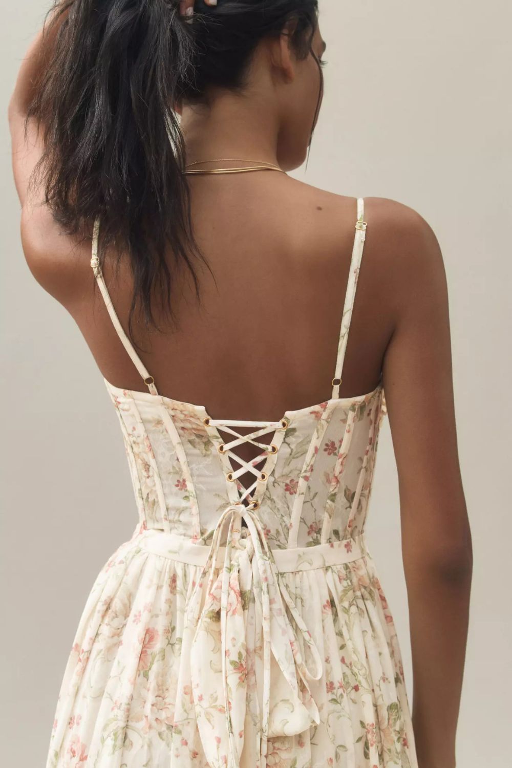Long corset dress with thin straps and ruffled hem in a floral design