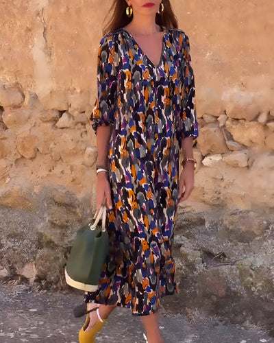 Midi dress with a V-neck and elegant retro print