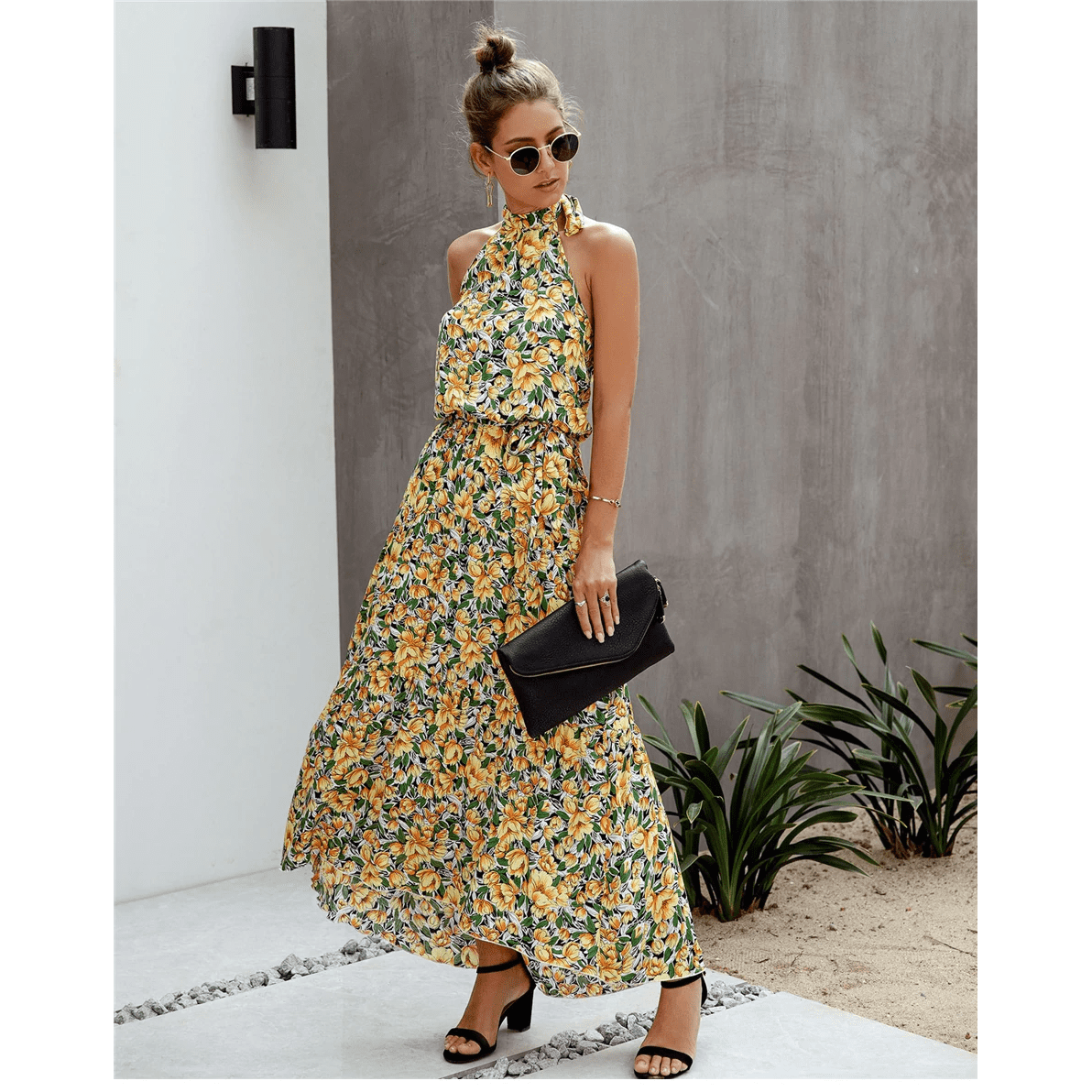Boho-style long dress with floral print and halter neck