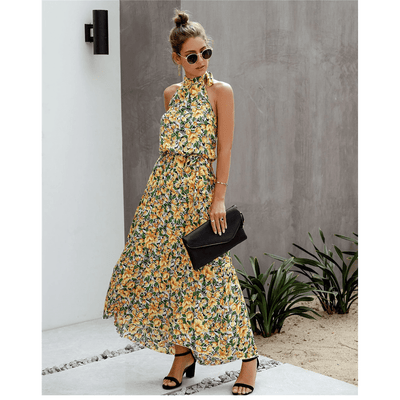 Boho-style long dress with floral print and halter neck