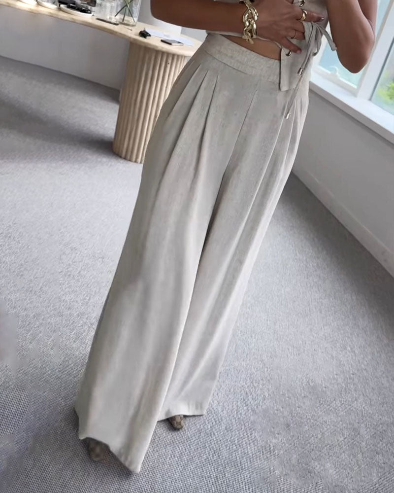 Two-piece set with a thin strap knotted top and flowing straight-leg pants