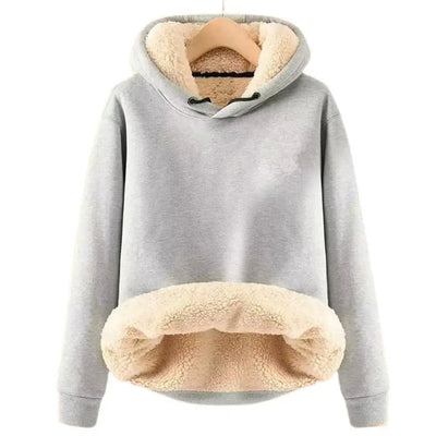 Warm women's coat with deep hood and long sleeves, ideal for cold days