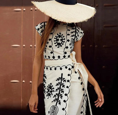 Printed sleeveless top and flowing skirt set, ideal for casual events
