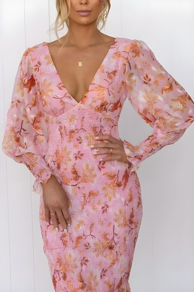Flowy midi dress with long sleeves and a subtle floral print for an elegant look