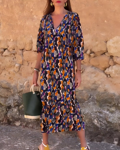 Midi dress with a V-neck and elegant retro print