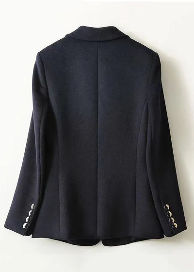 Loose-fitting navy coat with notched lapels and buttons, autumn