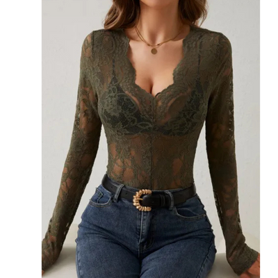 Elegant women's blouse with long sleeves and openwork details