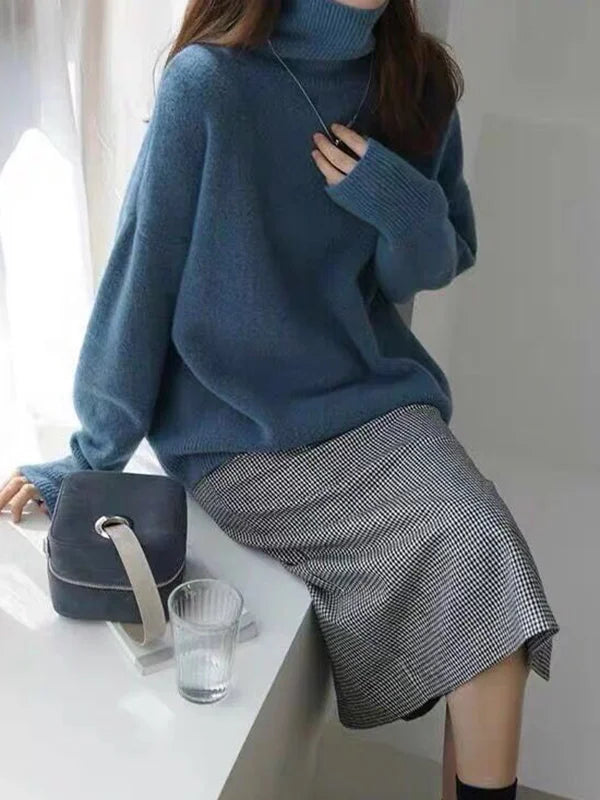 Elegant oversized sweater with long sleeves and a high neck