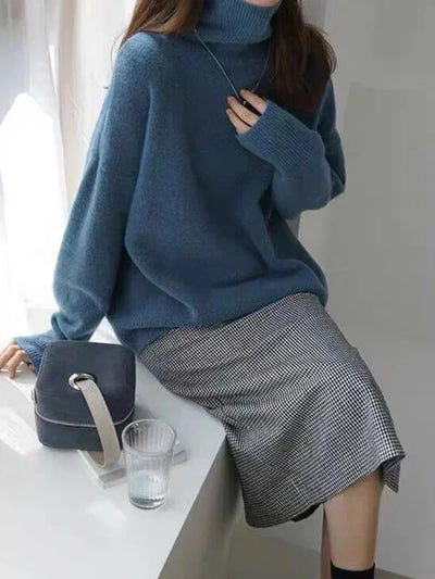 Elegant oversized sweater with long sleeves and a high neck