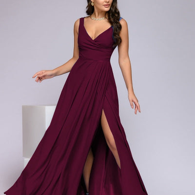Long sleeveless evening dress with a plunging neckline and high slit